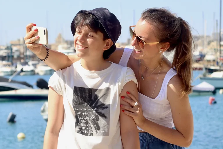Mother and a teenager enjoying summer evening on a pierse. Wisdom teeth removal summer
