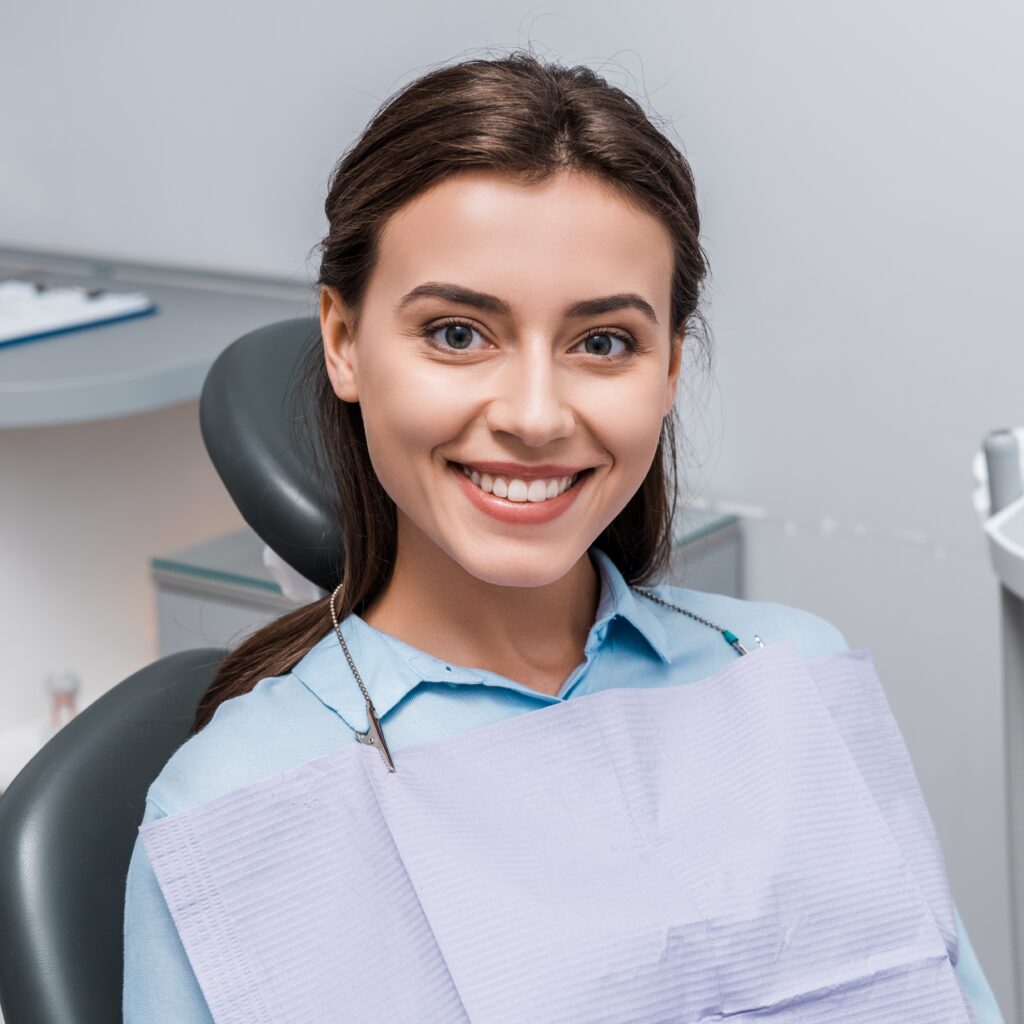 beautiful woman sitting and smiling in dental clin 2026 03 12 23 51 32 utc