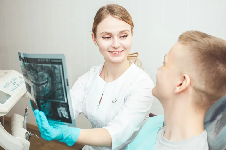 Oral surgeon explaining sinus precautions after tooth extraction to a Phoenix patient